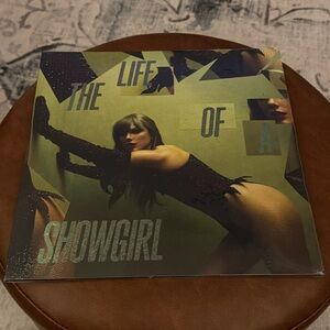 THE LIFE OF A SHOWGIRL:
THE SHINY BUG EDITION (VIOLET SHIMMER MARBLED VINYL)